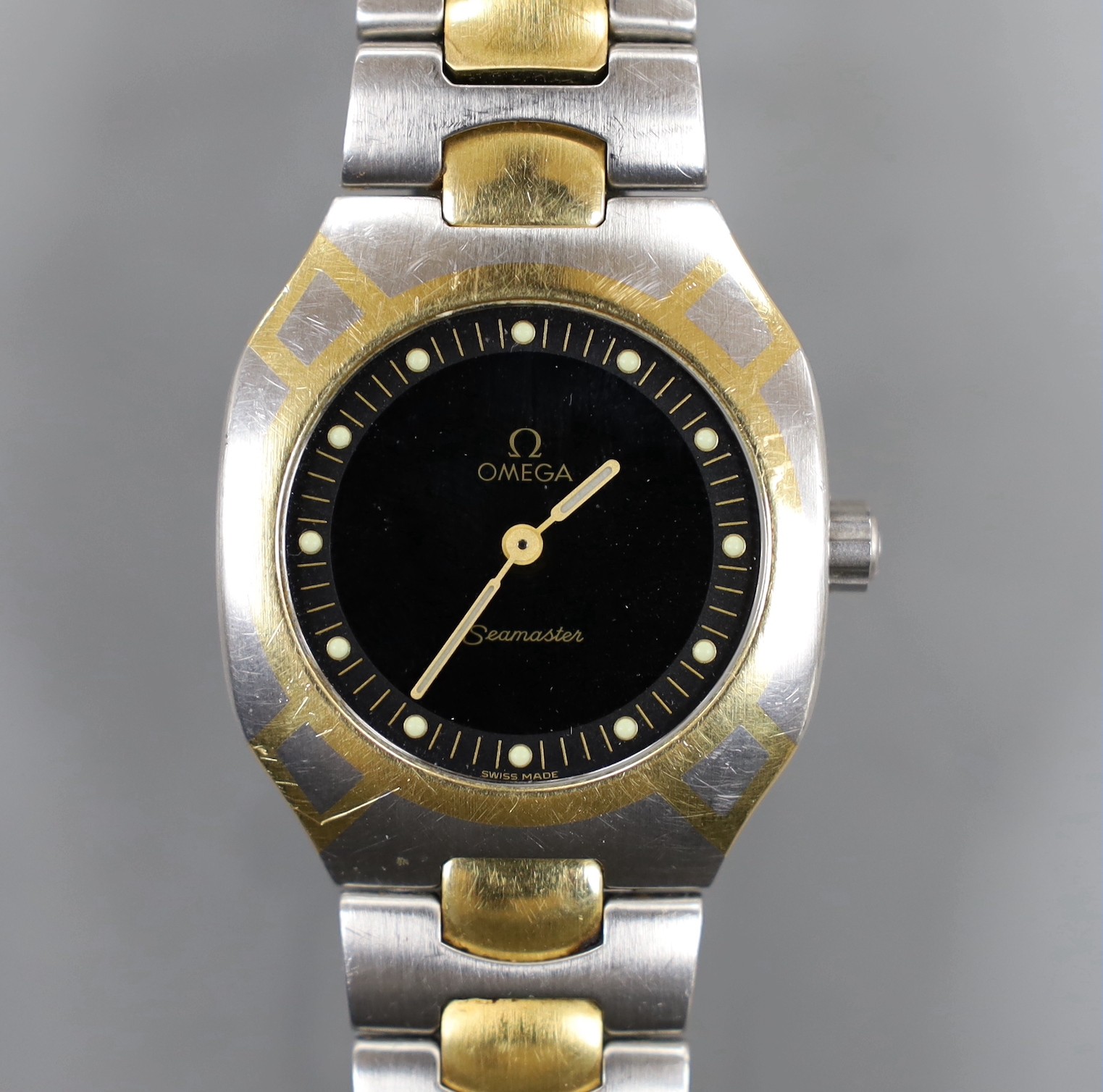 A gentleman's modern steel and gold plated Omega Seamaster quartz wrist watch, case diameter 32mm, with box, no papers.